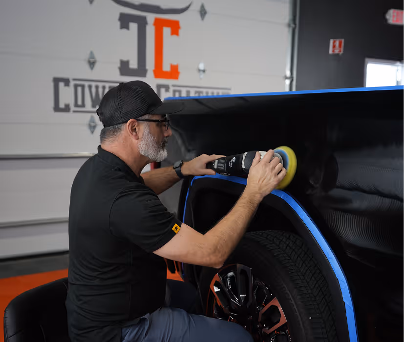 Cowboy Coating technician correcting a vehicle